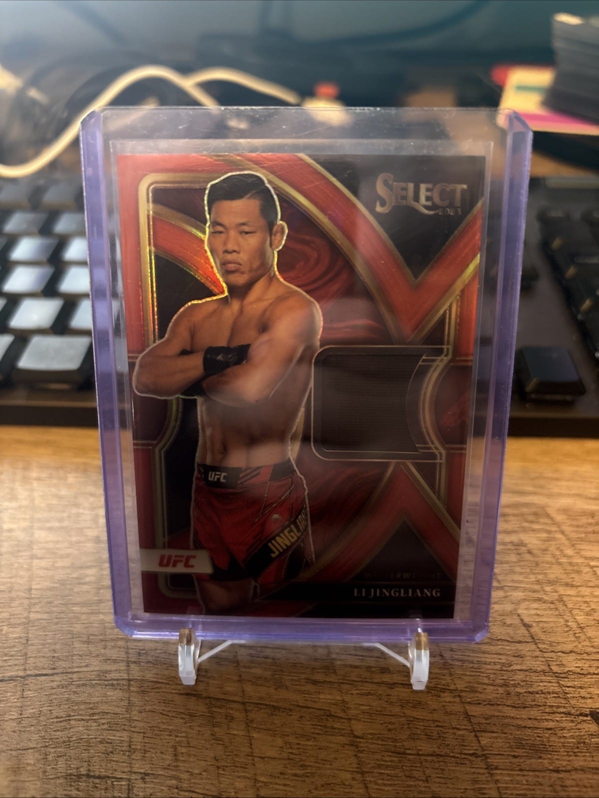 2023 Panini Select UFC Selective Swatches Li Jingliang #SS-LJG Red /99, photo